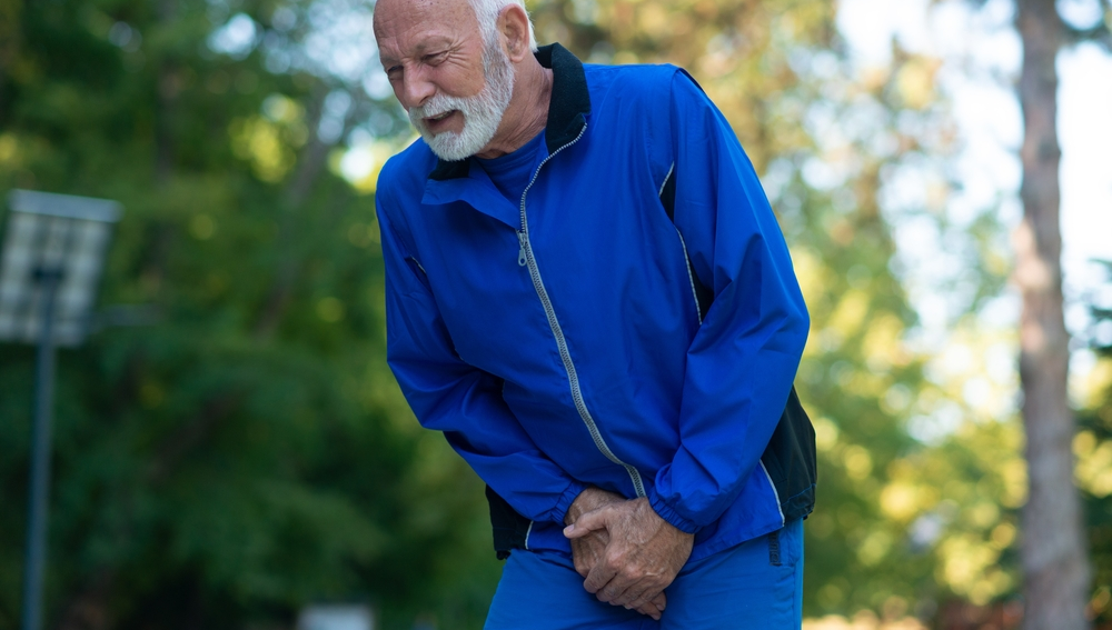 Senior man experiencing prostate pain e1647021853175
