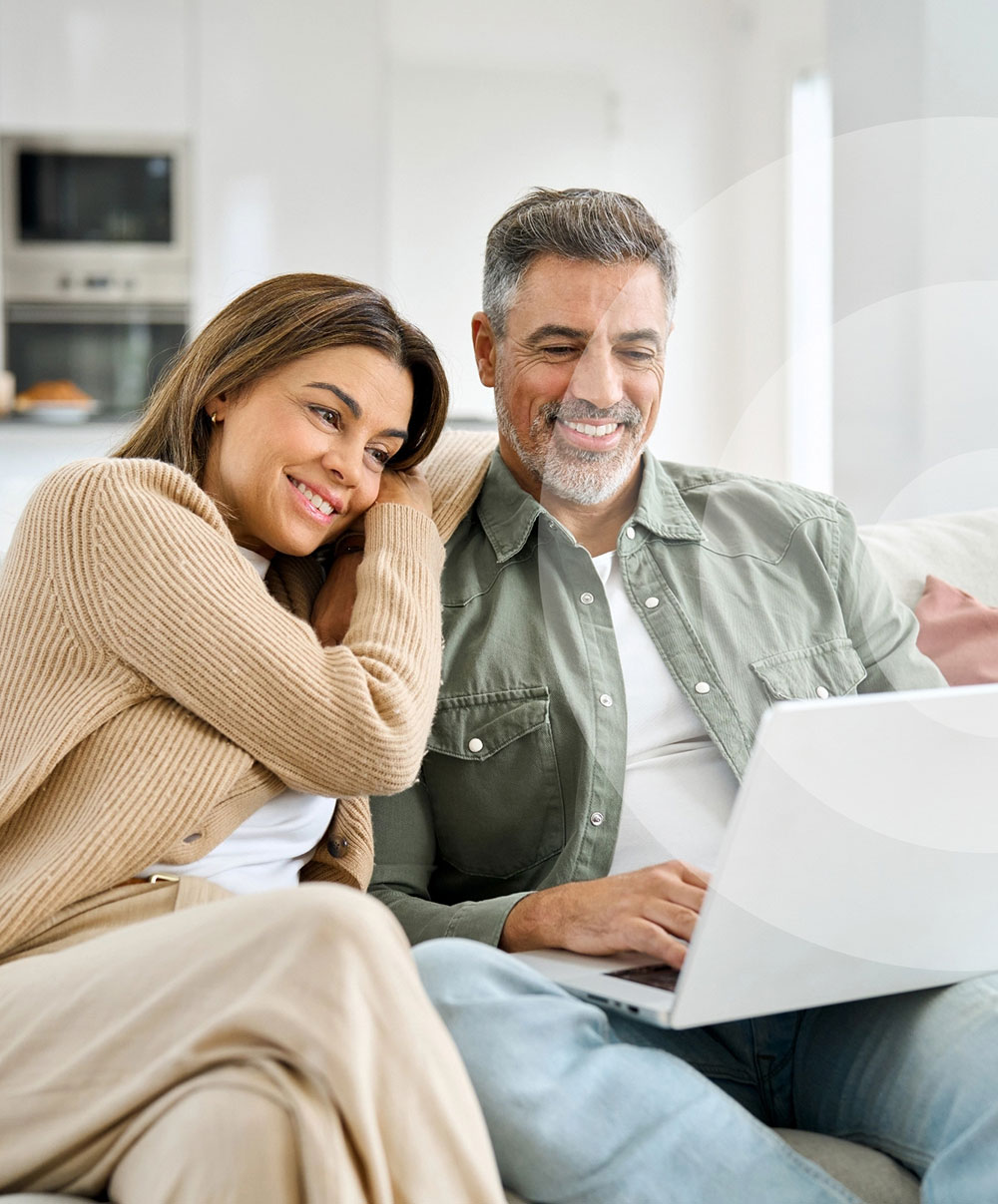 Couple looking at laptop screen